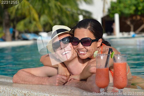 Image of happy young couple have fun on beach