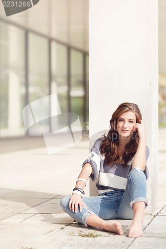 Image of attractive woman barefoot in summertime outdoor