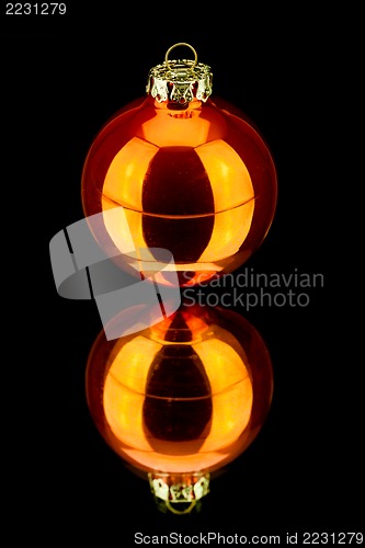 Image of christmas decoration in orange on black