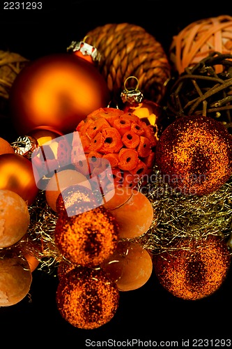 Image of christmas decoration in orange on black