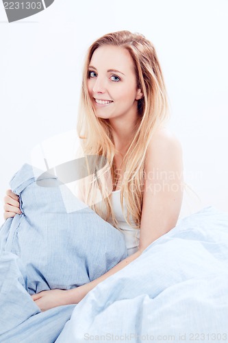 Image of cute blonde woman in the morning 