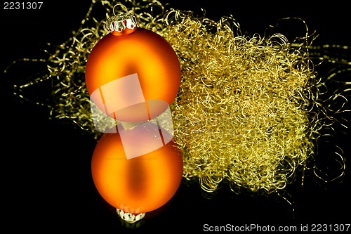 Image of christmas decoration in orange on black