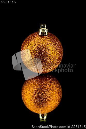 Image of christmas decoration in orange on black