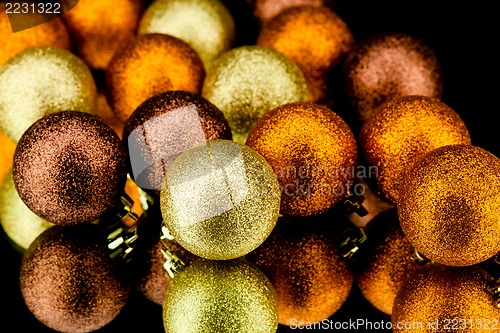 Image of christmas decoration in orange on black