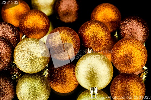 Image of christmas decoration in orange on black