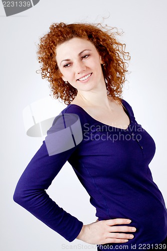 Image of attractive young redhead woman smiling portrait