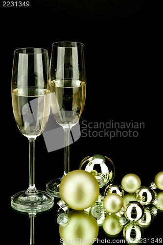 Image of christmas decoration and champagne on black