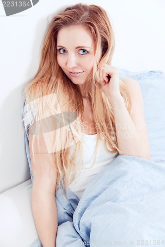 Image of cute blonde woman in the morning 