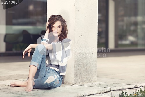 Image of attractive woman barefoot in summertime outdoor