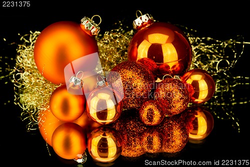Image of christmas decoration in orange on black