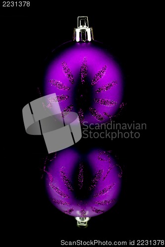 Image of christmas decoration in purple on black