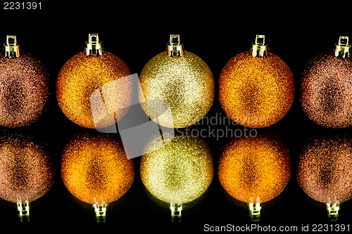 Image of christmas decoration in orange on black