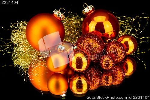Image of christmas decoration in orange on black