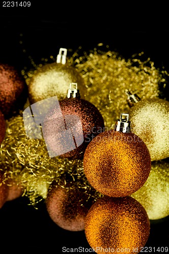 Image of christmas decoration in orange on black