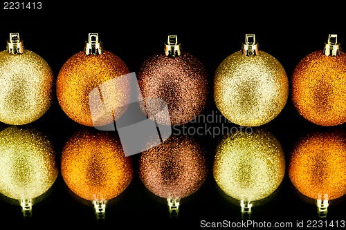 Image of christmas decoration in orange on black