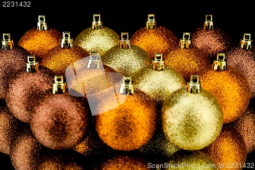 Image of christmas decoration in orange on black