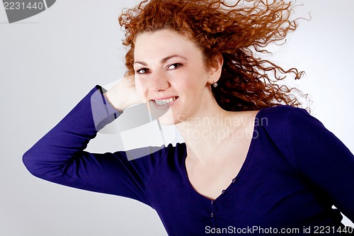 Image of attractive young redhead woman smiling portrait
