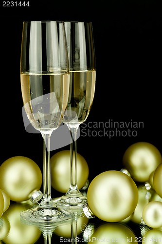 Image of christmas decoration and champagne on black