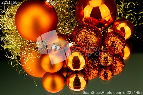 Image of christmas decoration in orange on black