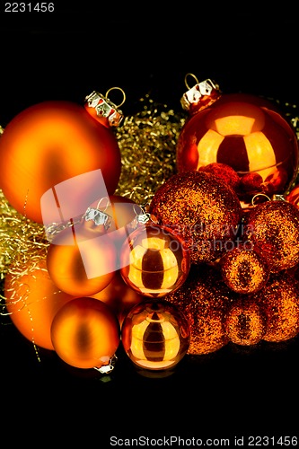 Image of christmas decoration in orange on black
