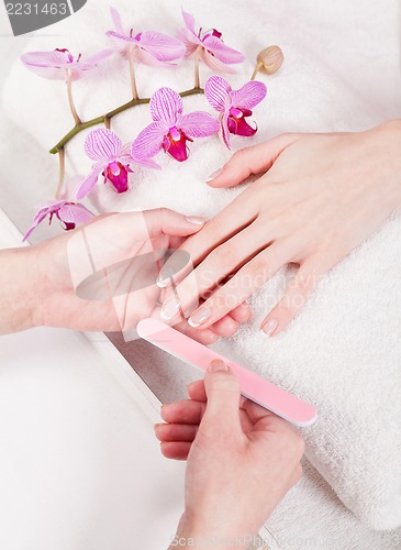 Image of manicure making in beauty spa salon 