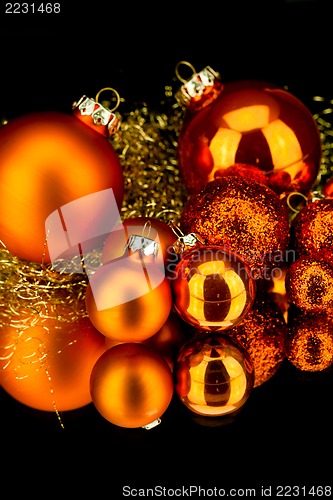 Image of christmas decoration in orange on black
