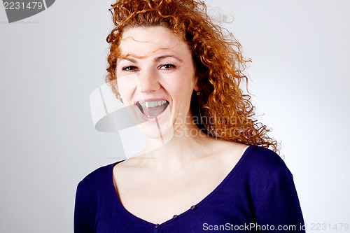 Image of attractive young redhead woman smiling portrait