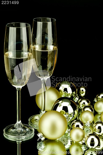 Image of christmas decoration and champagne on black