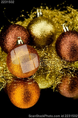 Image of christmas decoration in orange on black