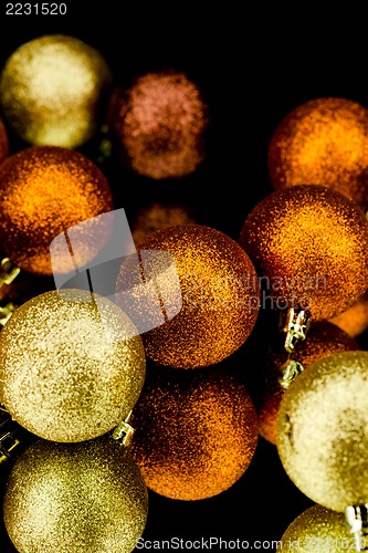 Image of christmas decoration in orange on black