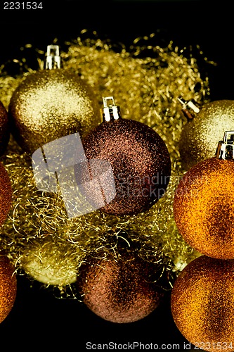 Image of christmas decoration in orange on black