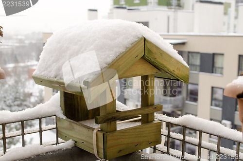 Image of wooden small house birdie abundant snow roof  