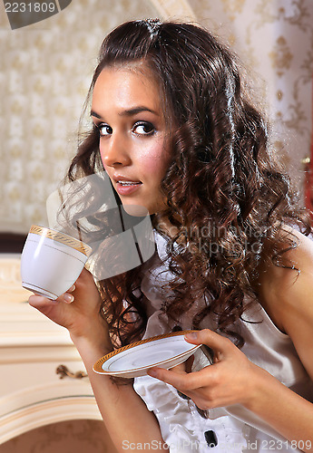 Image of girl with white tea cup