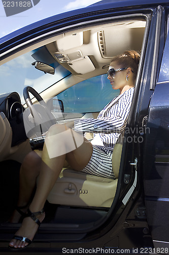 Image of smart woman in the car