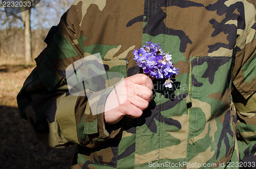 Image of soldier camouflage hand violet flowers girlfriend 