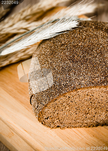 Image of Black homemade bread and rye cones, close-up 