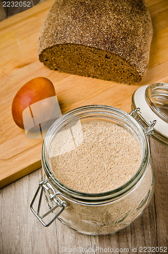 Image of Black homemade bread, rye flour and egg , close-up 