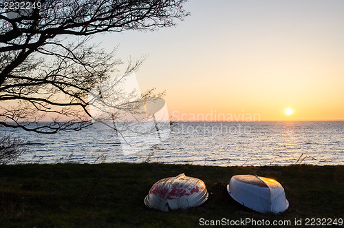 Image of Rowing boats at sunset