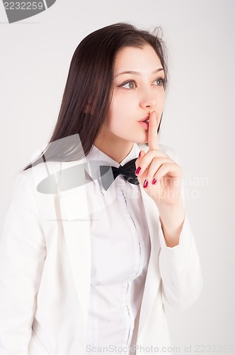 Image of Beautiful woman gesturing to silence