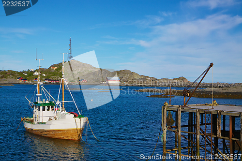 Image of Fishing boat by pier