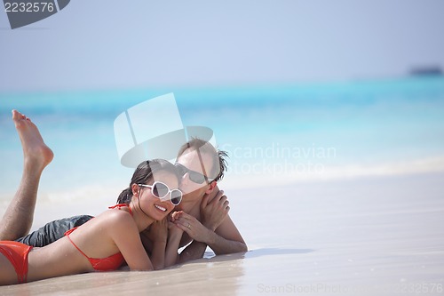 Image of happy young couple have fun on beach