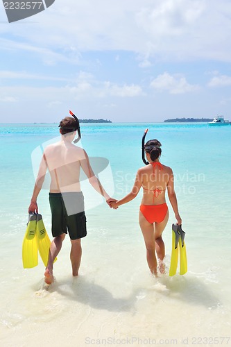 Image of happy young couple have fun on beach