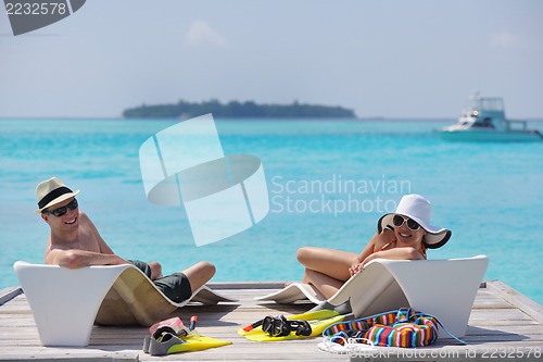 Image of happy young couple have fun on beach