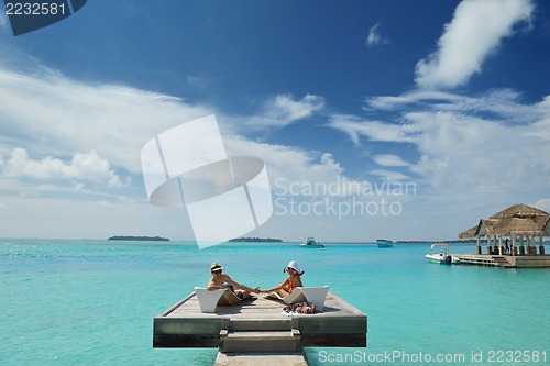 Image of happy young couple have fun on beach