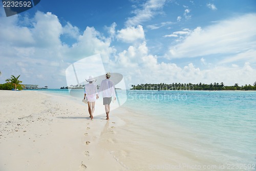Image of happy young couple have fun on beach