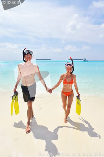 Image of happy young couple have fun on beach