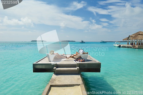Image of happy young couple have fun on beach