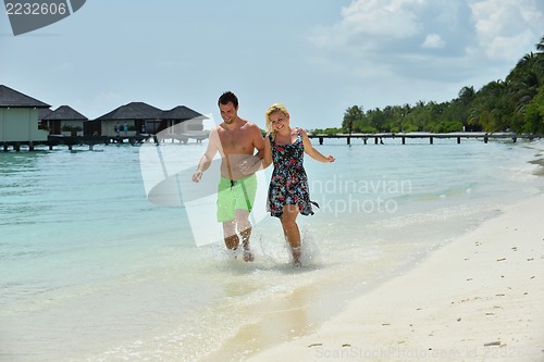 Image of happy young  couple at summer vacation have fun and relax at bea