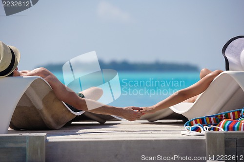 Image of happy young couple have fun on beach
