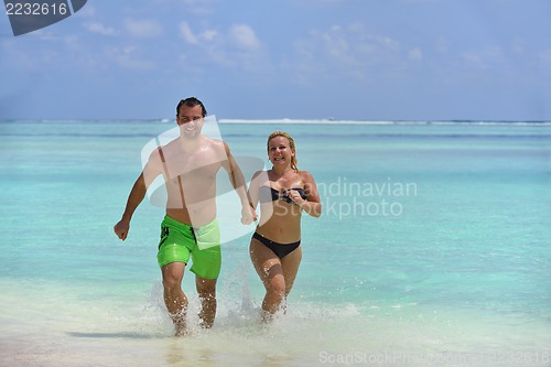 Image of happy young  couple at summer vacation have fun and relax at bea